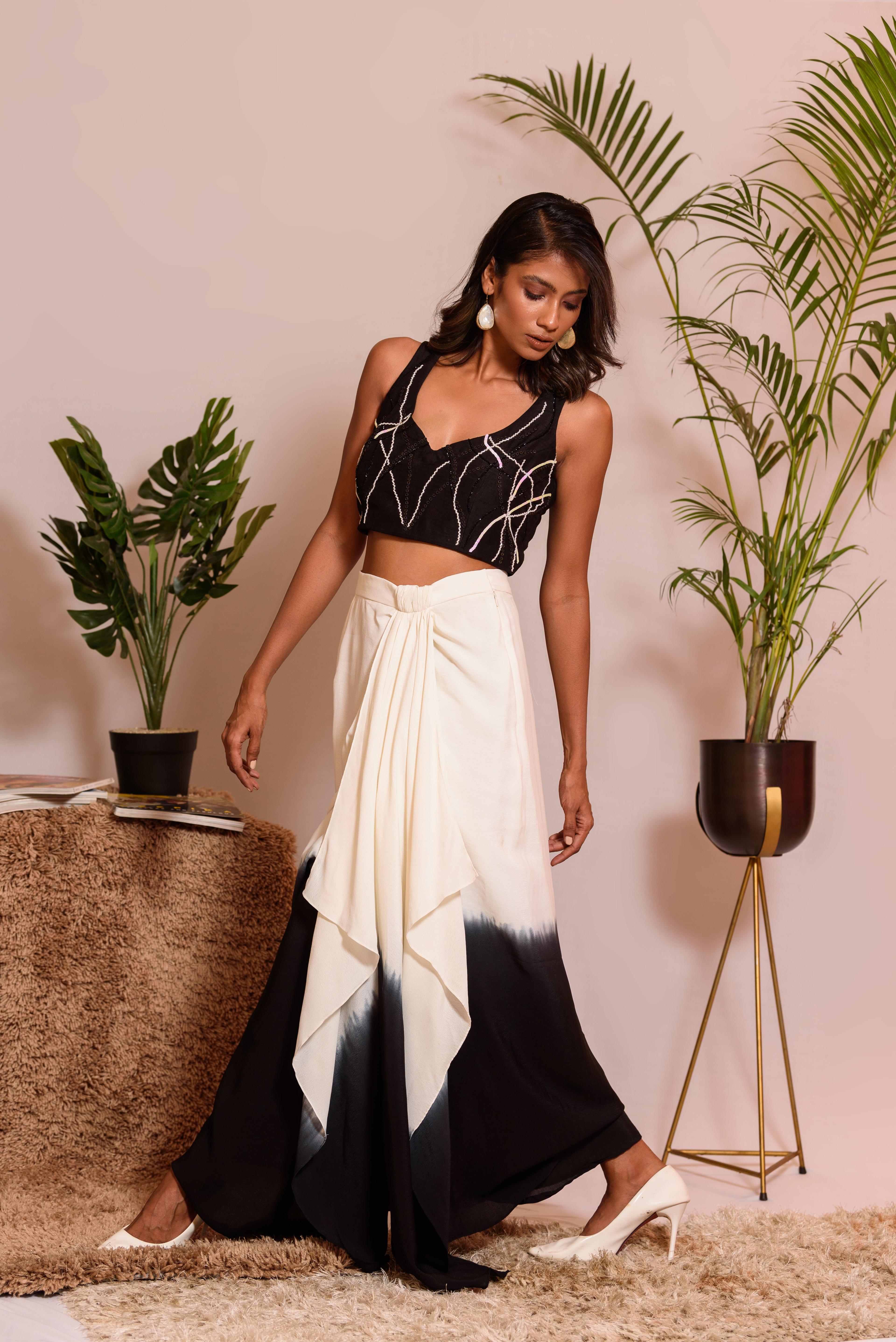 Black embroidered crop top withshaded knot skirt, a product by Vanshika